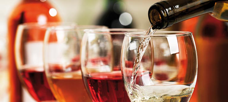 Wine being poured into glasses